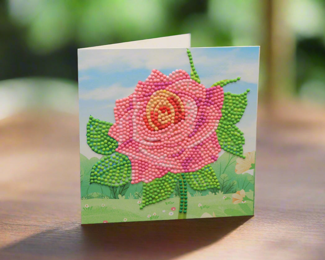 Huge Pink Singular Rose with Yellow Center and Foliage. Red, Green and Pink Crystal Rhinestones are so pretty