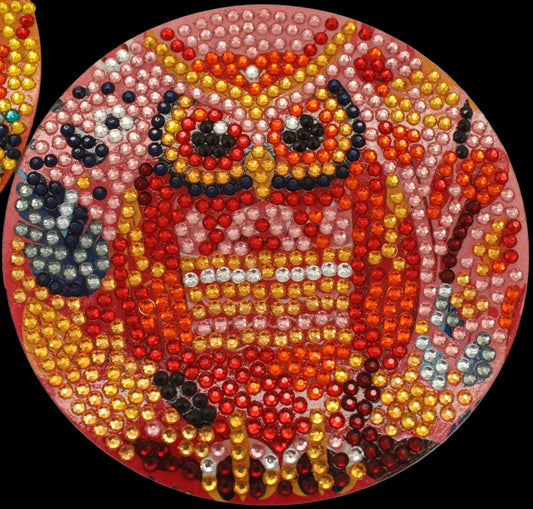 Colorful owl-themed bead art on circular canvases.