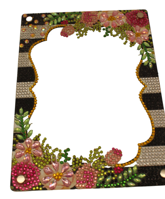 Decorative mirror with floral and geometric design on a beige background