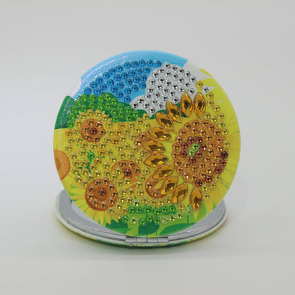 Stunning Round Shaped Compact with Sunflowers Yellow, Brown and Blue