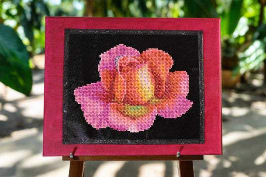 Hand Painted Background. Diamond Art is a Rock Star Worthy Rose with Rink and Light Orange Hues; Canvas is Painted a Crimson Magenta.