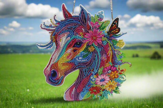 Colorful unicorn purse with floral decorations on a white background