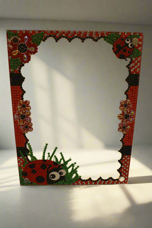 Decorative frame with ladybug and floral patterns on a beige background