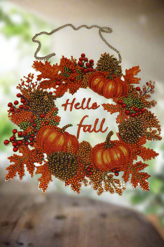 Decorative wreath with pumpkins and leaves on a beige background
