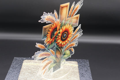 3D glass sculpture of sunflowers and wheat on a black background