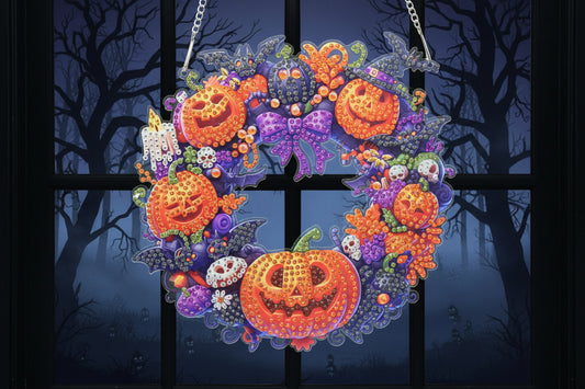 Decorative Halloween wreath with pumpkins and flowers on a dark background