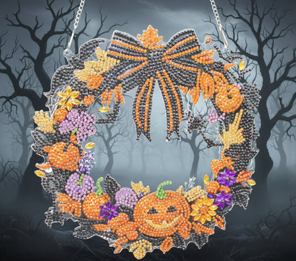 Decorative Halloween wreath with pumpkins and flowers on a dark background