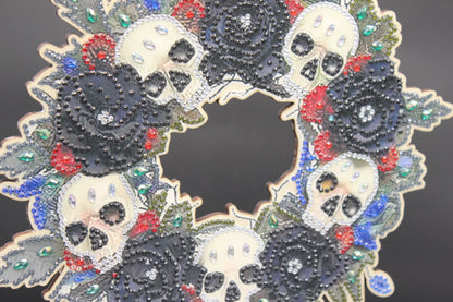 Decorative wreath with skulls and rhinestones on a dark background