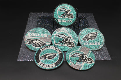 Set of Philadelphia Eagles-themed coasters with rhinestone embellishments on a dark background