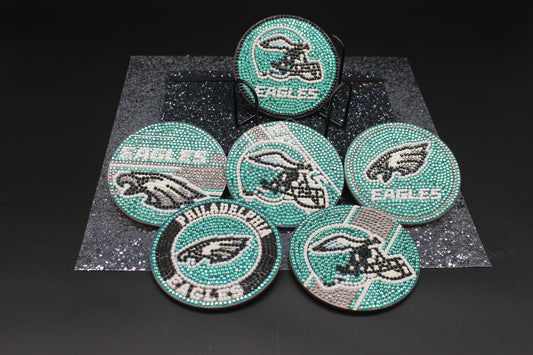 Set of Philadelphia Eagles-themed coasters with rhinestone embellishments on a dark background