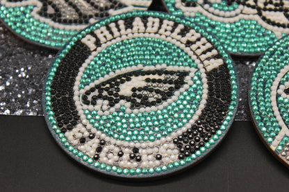 Decorative coasters with Philadelphia Eagles logo and text on a black background