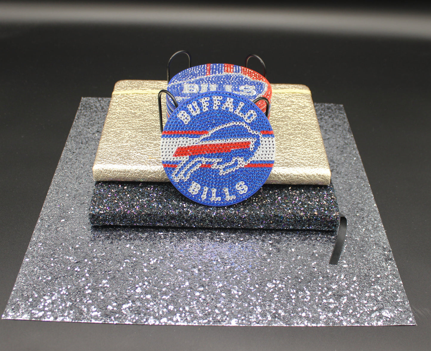 Buffalo Bills logo patch on a clear stand with a black background