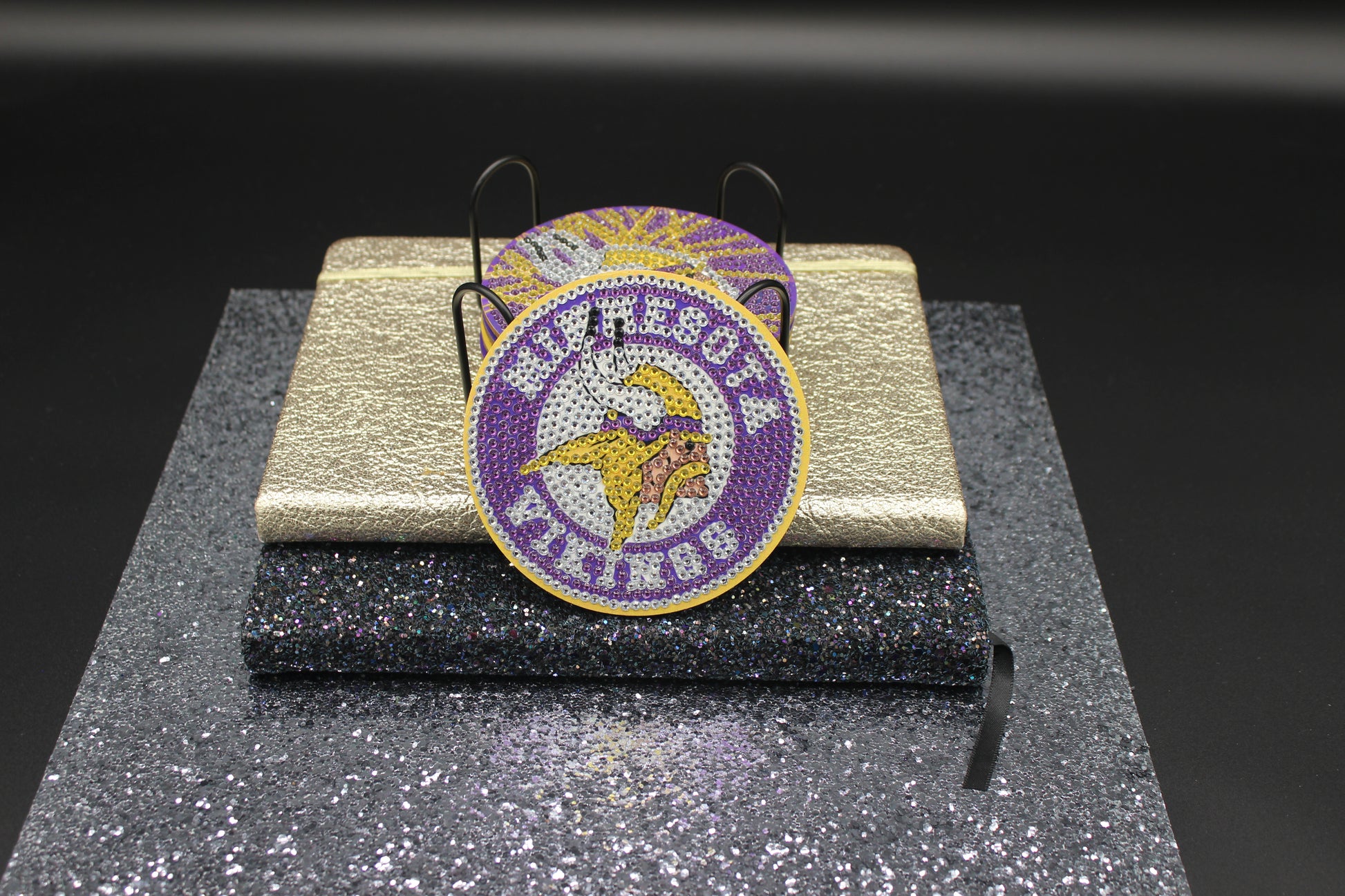 Minnesota Vikings Coasters on a stand with a dark background