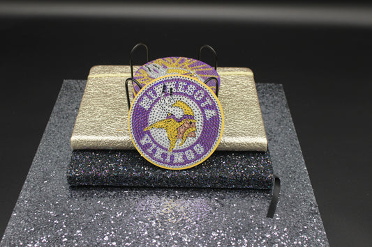 Minnesota Vikings Coasters on a stand with a dark background