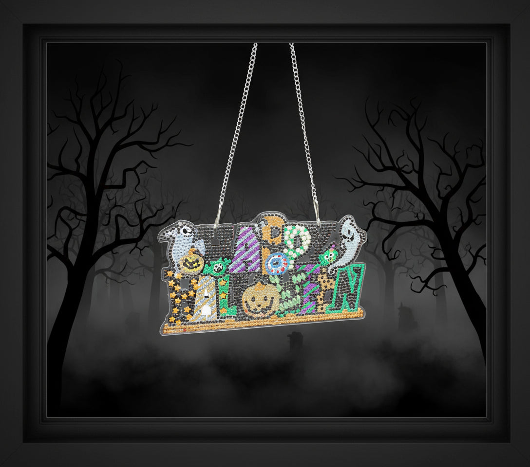 Decorative Halloween sign with beaded design on a black background