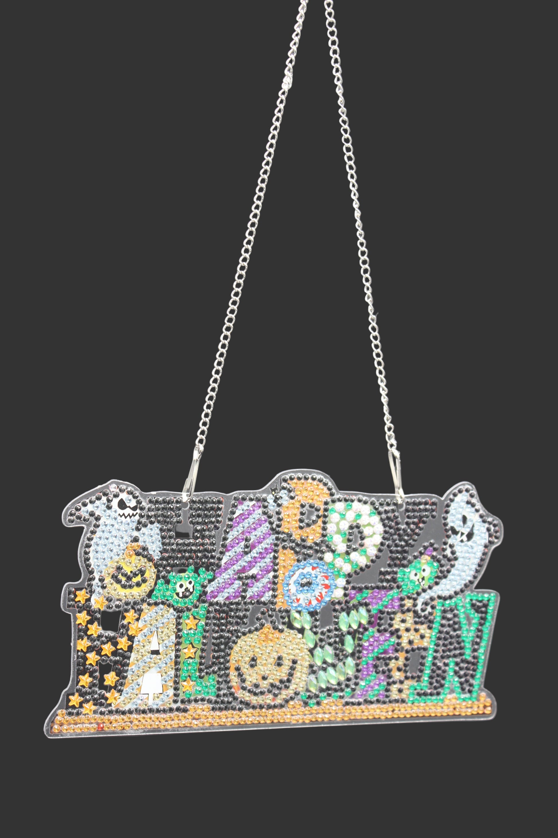 Decorative necklace with a colorful pendant on a dark background