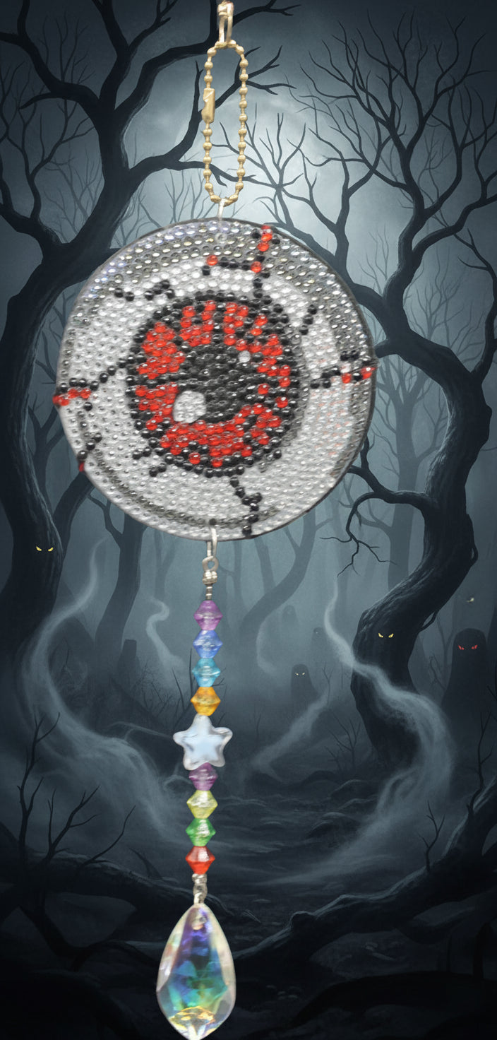 Decorative hanging ornament with colorful beads and patterns on a dark background