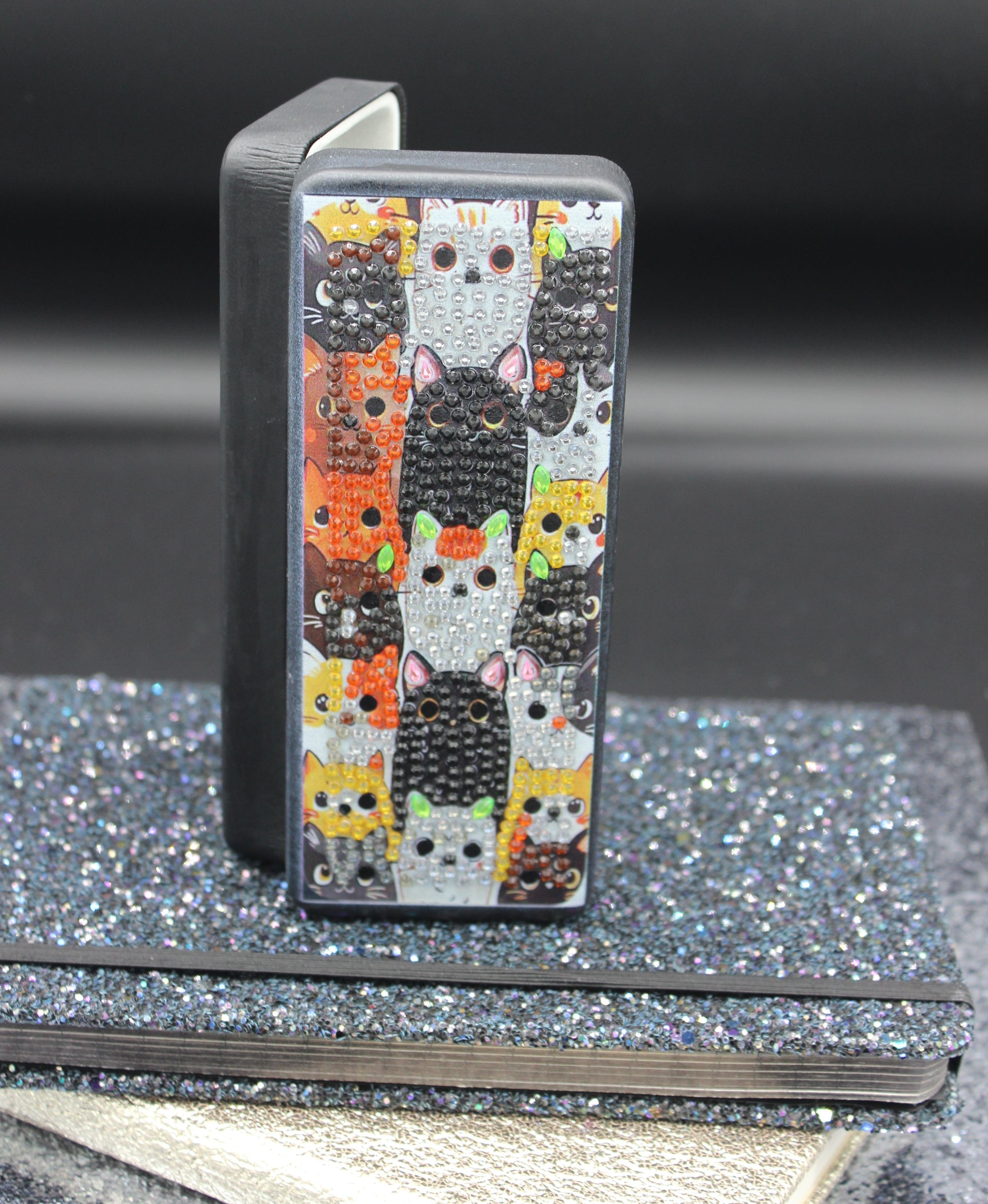 Decorative metal pedal with colorful cat pattern on a vehicle step.