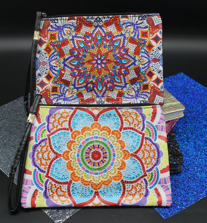 Colorful mandala-patterned pouches on a black surface with blue textured mat
