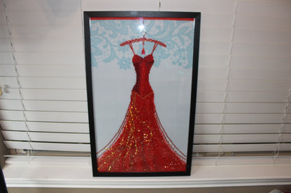 Gorgeous Diamond Art Red Dress Hanging on a Red Clothes Hanger