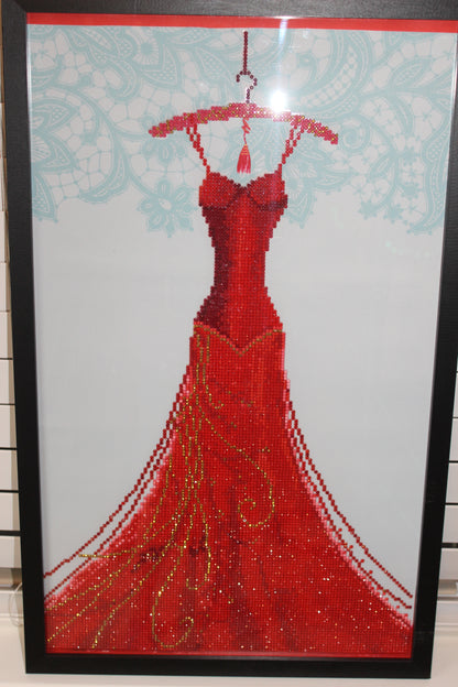Gorgeous Diamond Art Red Dress Hanging on a Red Clothes Hanger