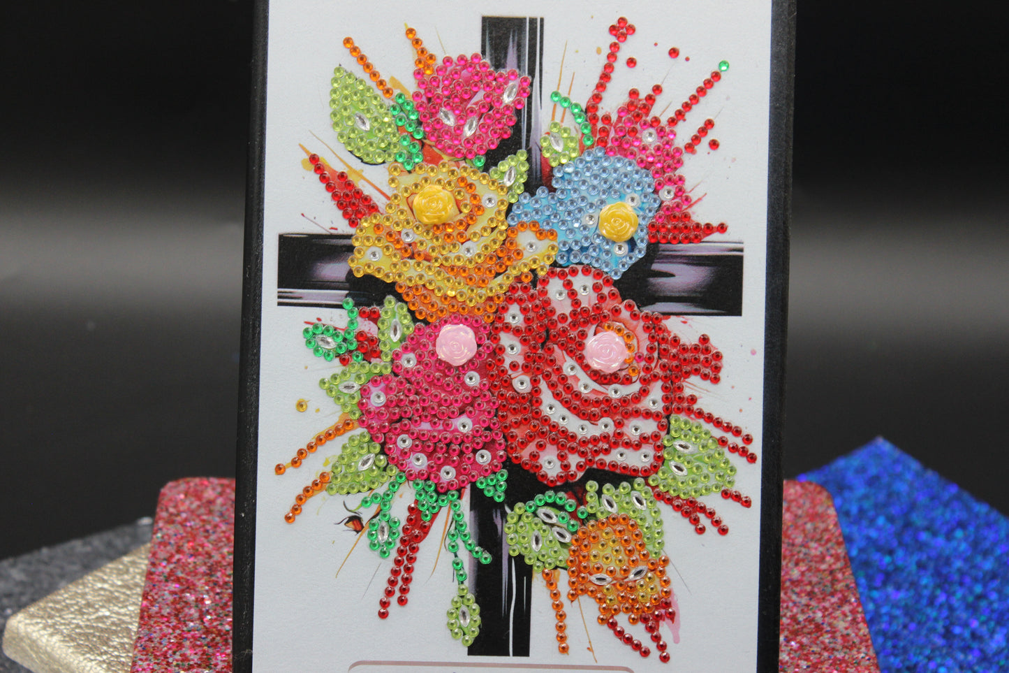 Diamond Art Journal With Multi Colored Flower Adorned to a Cross