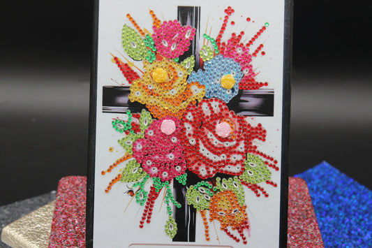 Diamond Art Journal With Multi Colored Flower Adorned to a Cross
