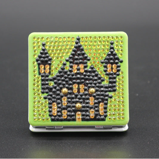 Square Shaped Halloween Compact Mirror with a Black Haunted Mansion and Scary Green Background, all in Crystal Rhinestones